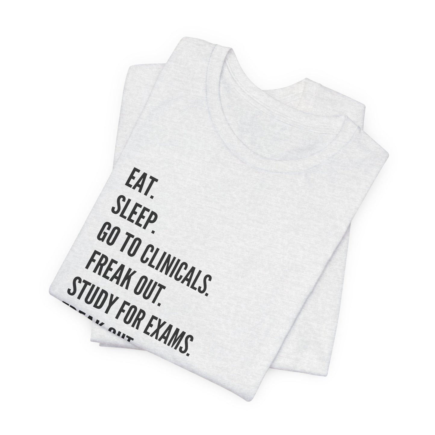 Nursing Student Tee — “Eat. Sleep. Go to Clinicals. Freak Out. Study for Exams. Freak Out. Slay. Repeat.”