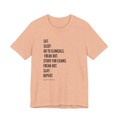 Nursing Student Tee — “Eat. Sleep. Go to Clinicals. Freak Out. Study for Exams. Freak Out. Slay. Repeat.”