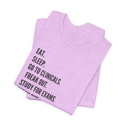 Nursing Student Tee — “Eat. Sleep. Go to Clinicals. Freak Out. Study for Exams. Freak Out. Slay. Repeat.”