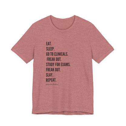 Nursing Student Tee — “Eat. Sleep. Go to Clinicals. Freak Out. Study for Exams. Freak Out. Slay. Repeat.”