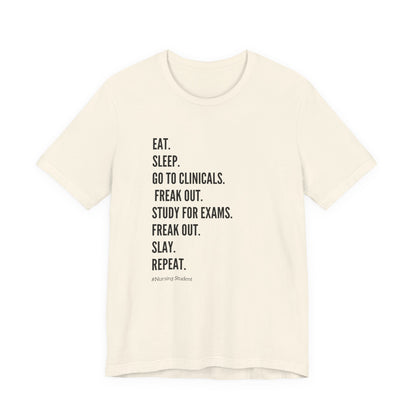 Nursing Student Tee — “Eat. Sleep. Go to Clinicals. Freak Out. Study for Exams. Freak Out. Slay. Repeat.”