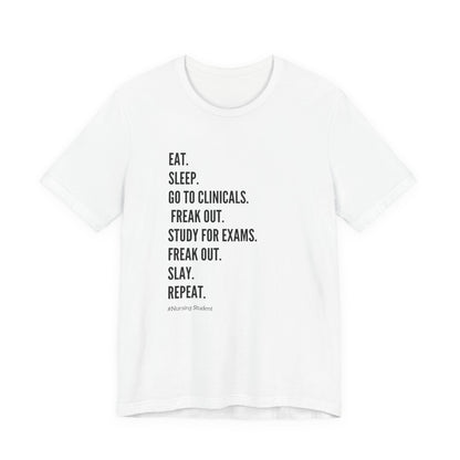 Nursing Student Tee — “Eat. Sleep. Go to Clinicals. Freak Out. Study for Exams. Freak Out. Slay. Repeat.”