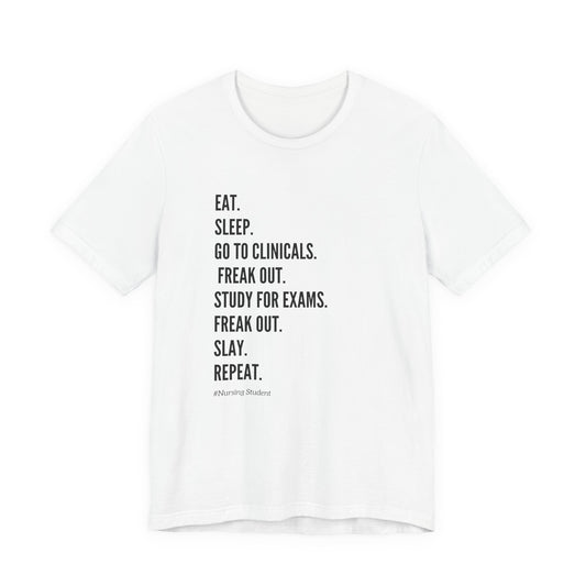 Nursing Student Tee — “Eat. Sleep. Go to Clinicals. Freak Out. Study for Exams. Freak Out. Slay. Repeat.”